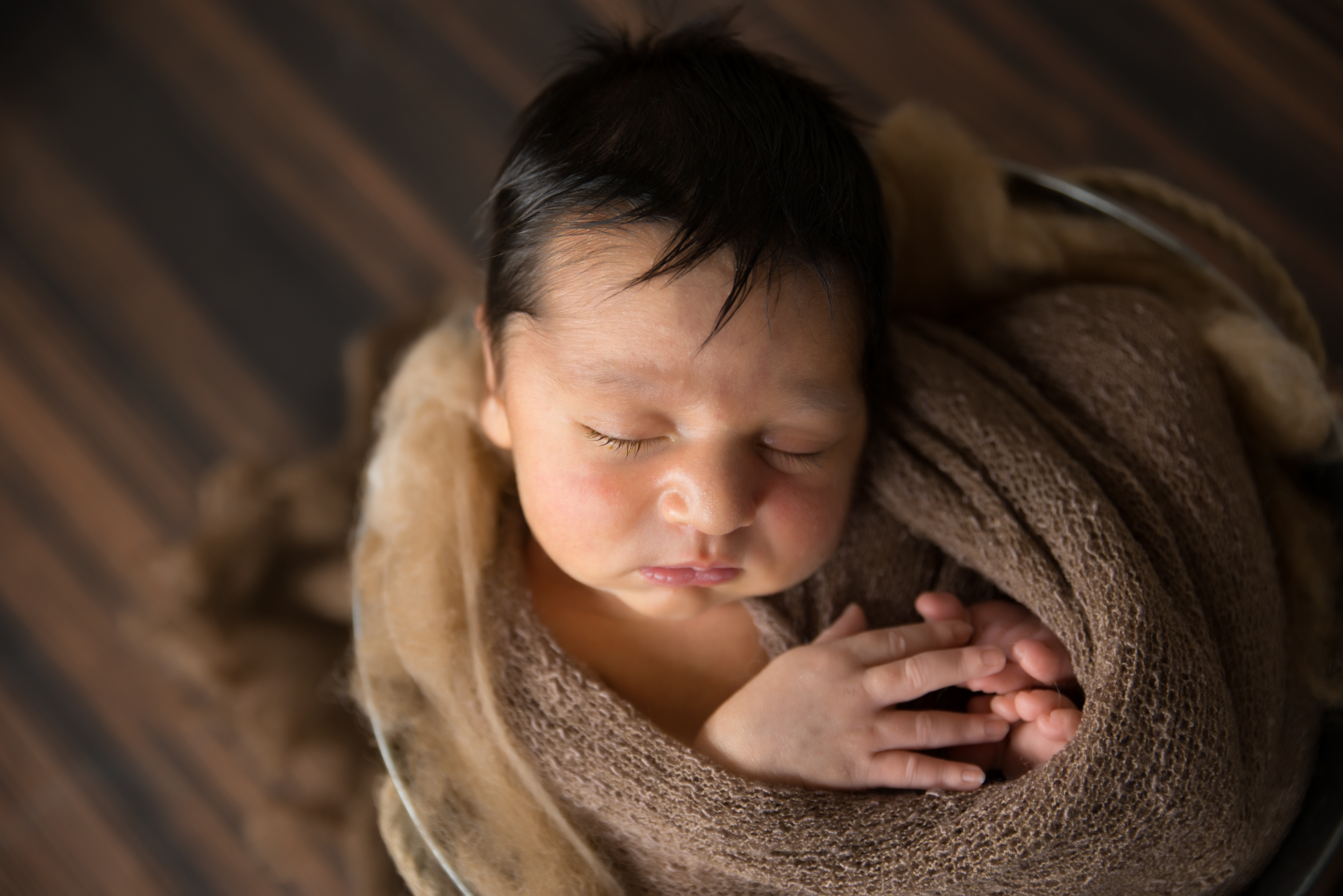 Newborn baby wrapped in tin bucket