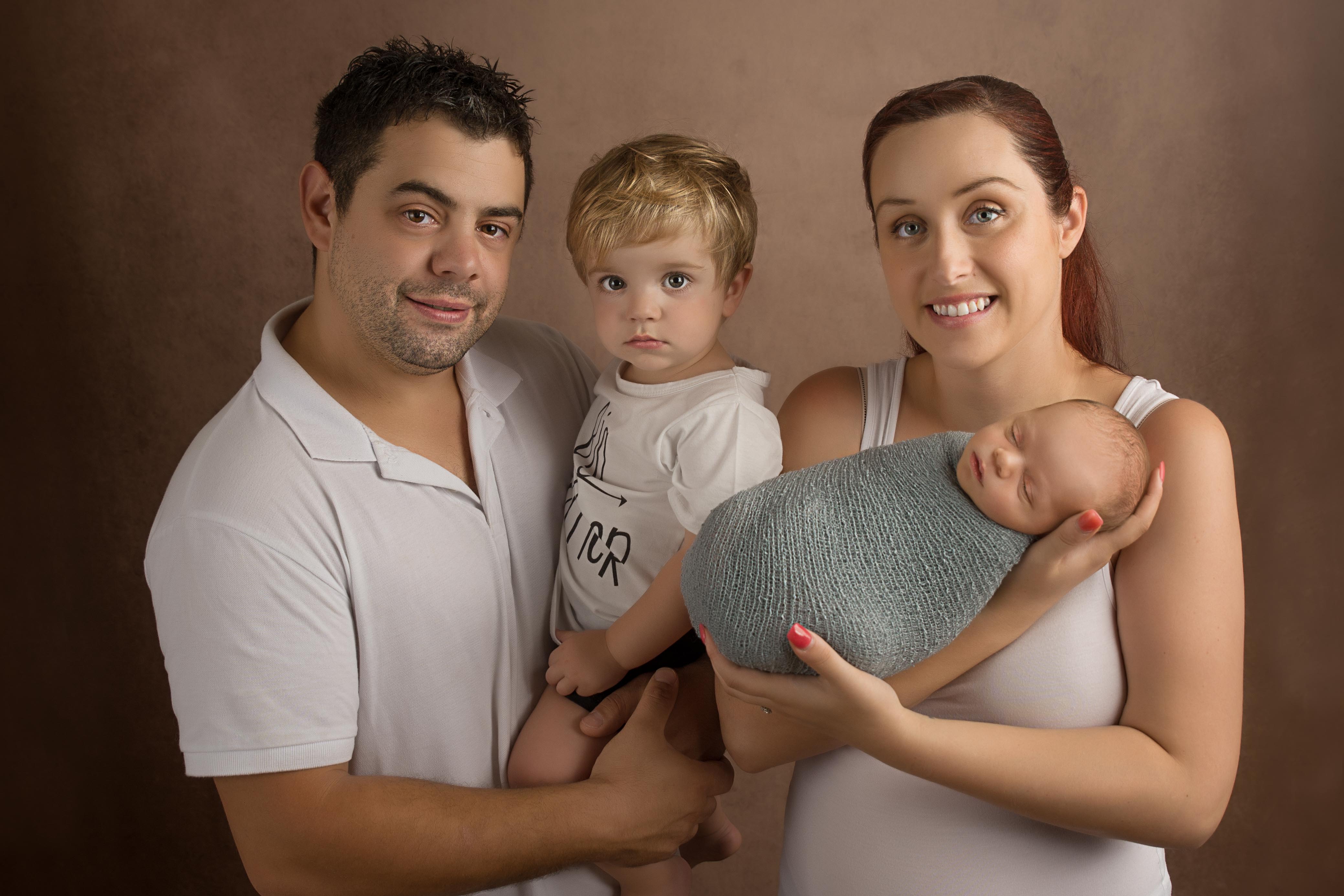 Beautiful family photo with newborn baby.