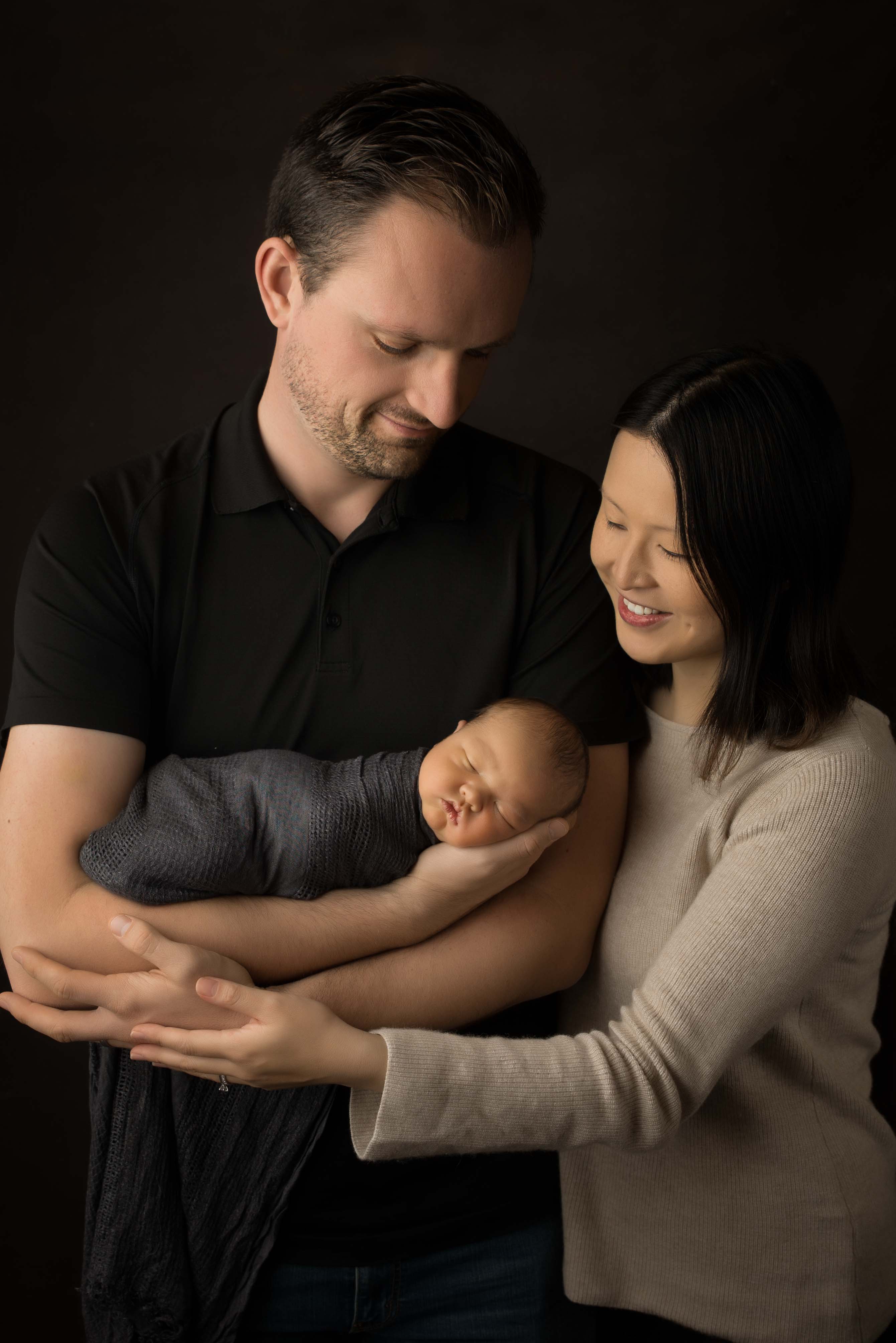 Mum, Dad and newborn baby photograph.