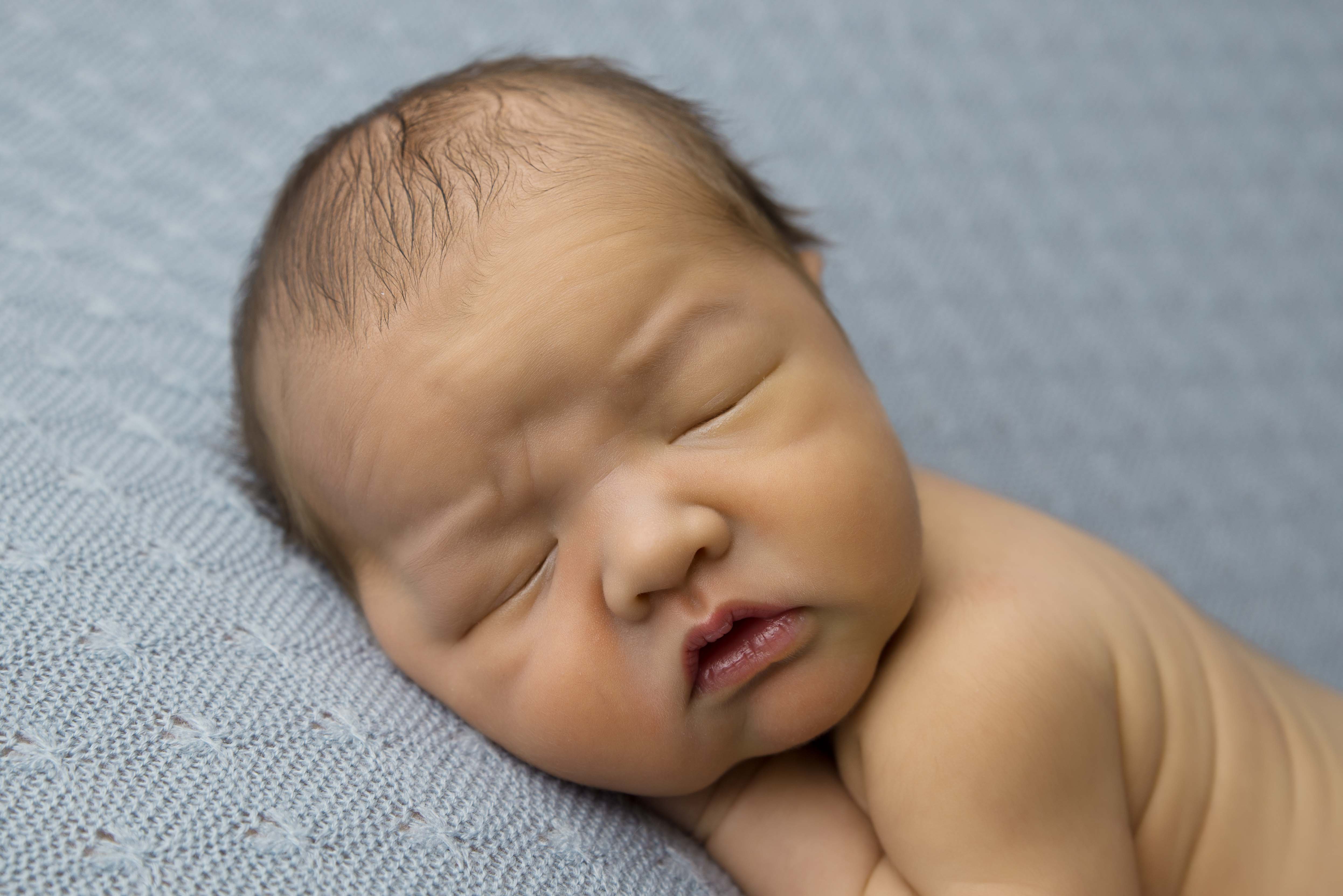 close up of newborn baby's face for newborn photography. 