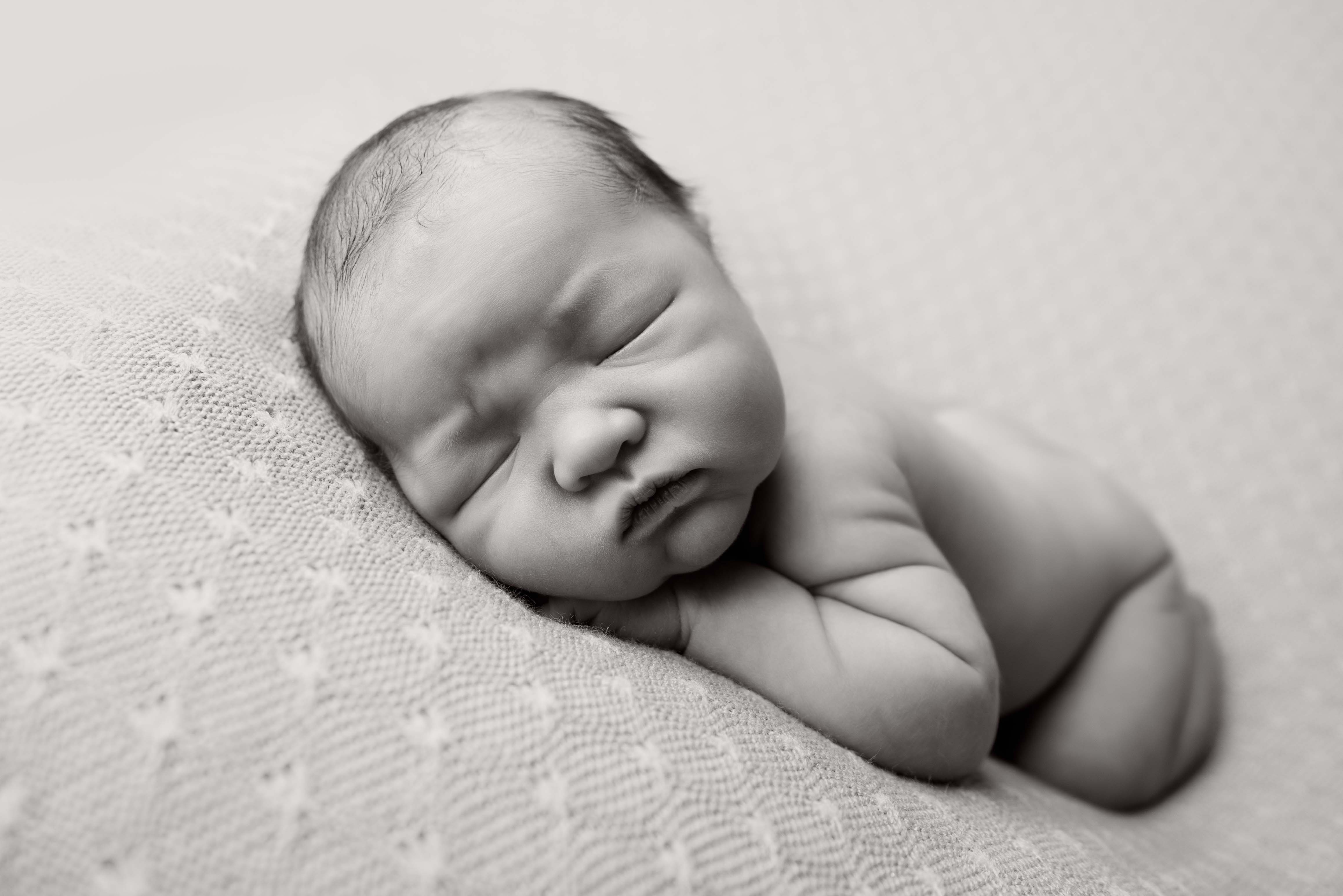 Black and white image of newborn baby.