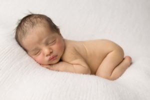 Bum up pose of newborn baby.