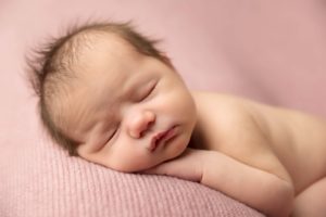 Beautiful newborn baby girl posed for newborn photography 