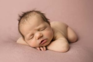 Head on hands pose newborn photography 