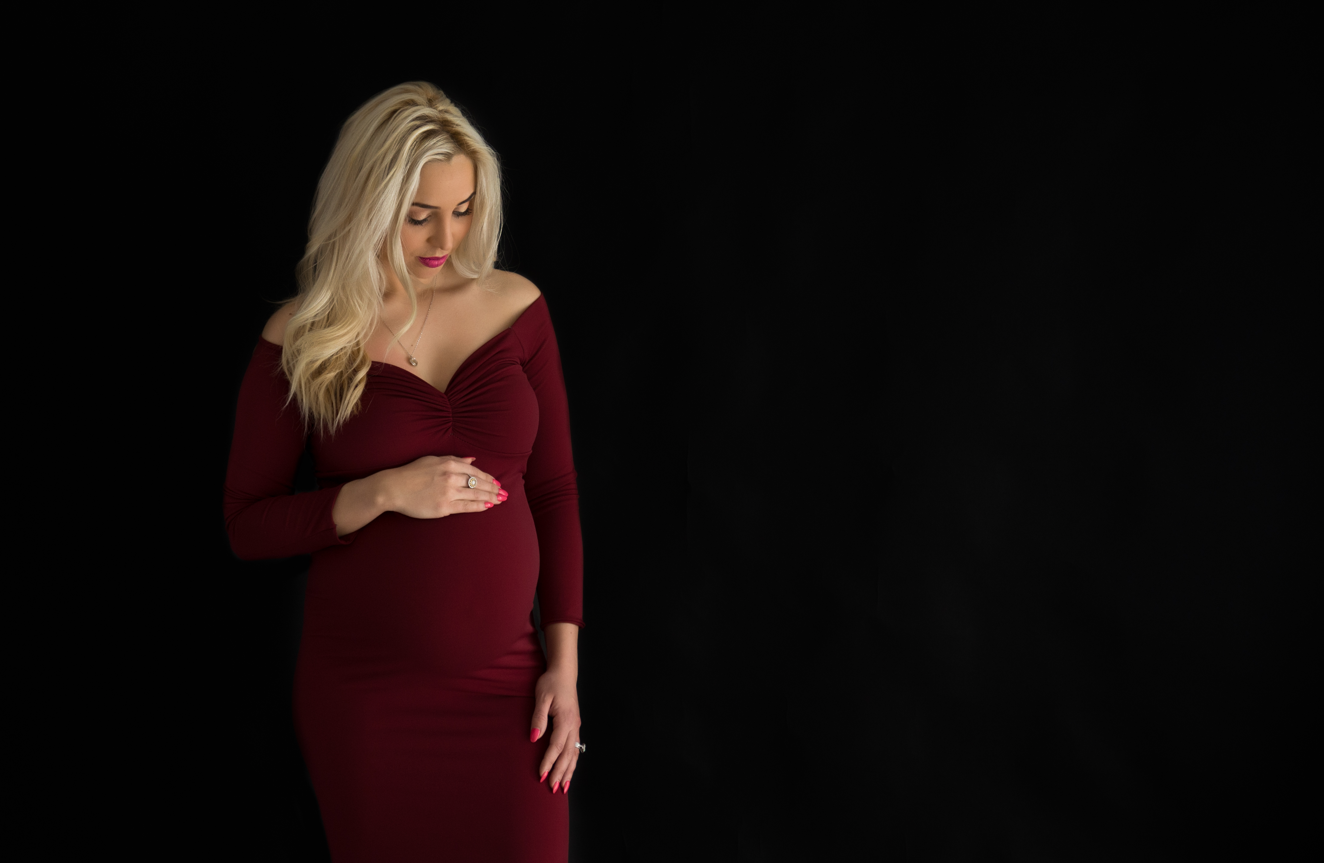 Maternity photo in red dress for photography