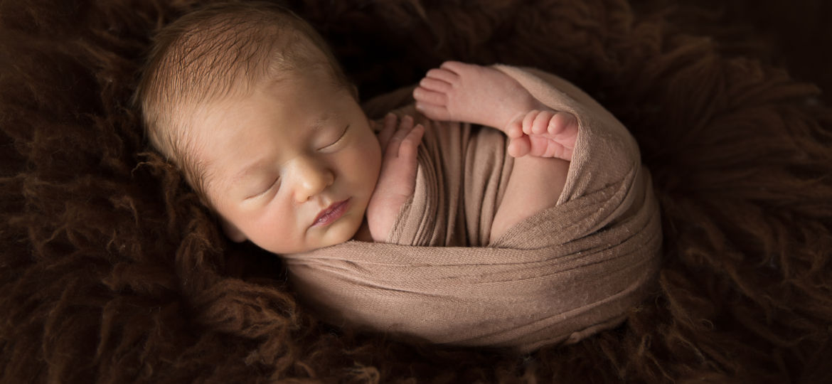 newborn baby wrapped for newborn photography