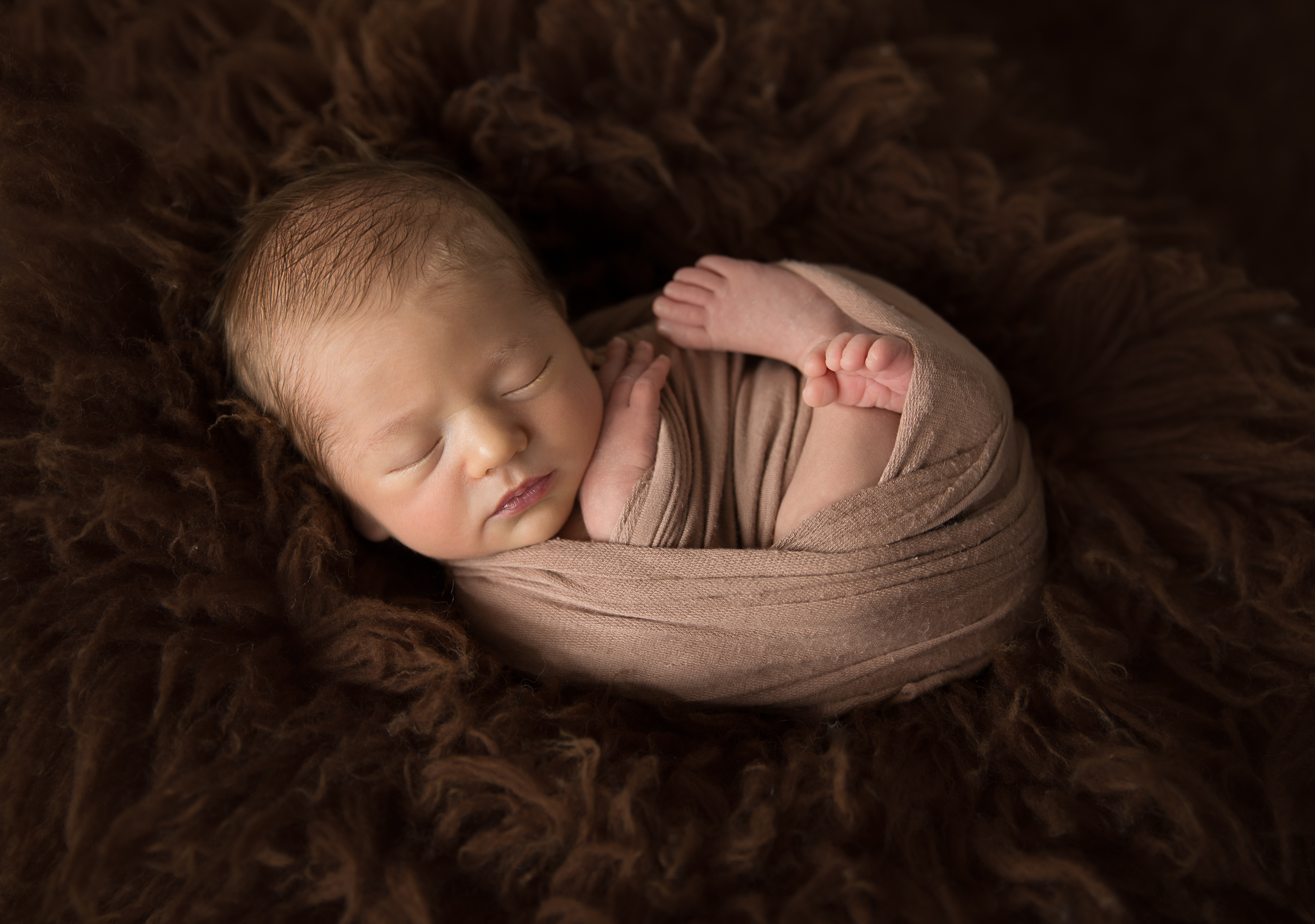 newborn baby wrapped for newborn photography