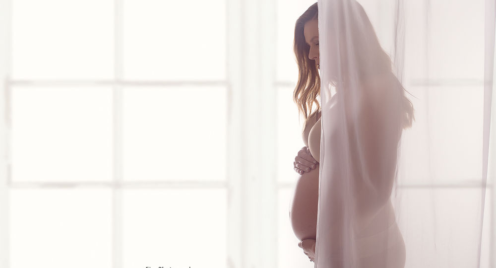 Maternity photo infant of window