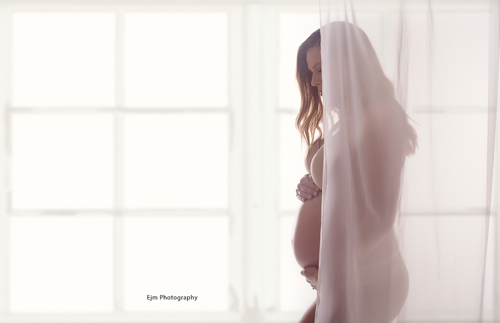 Maternity photo infant of window