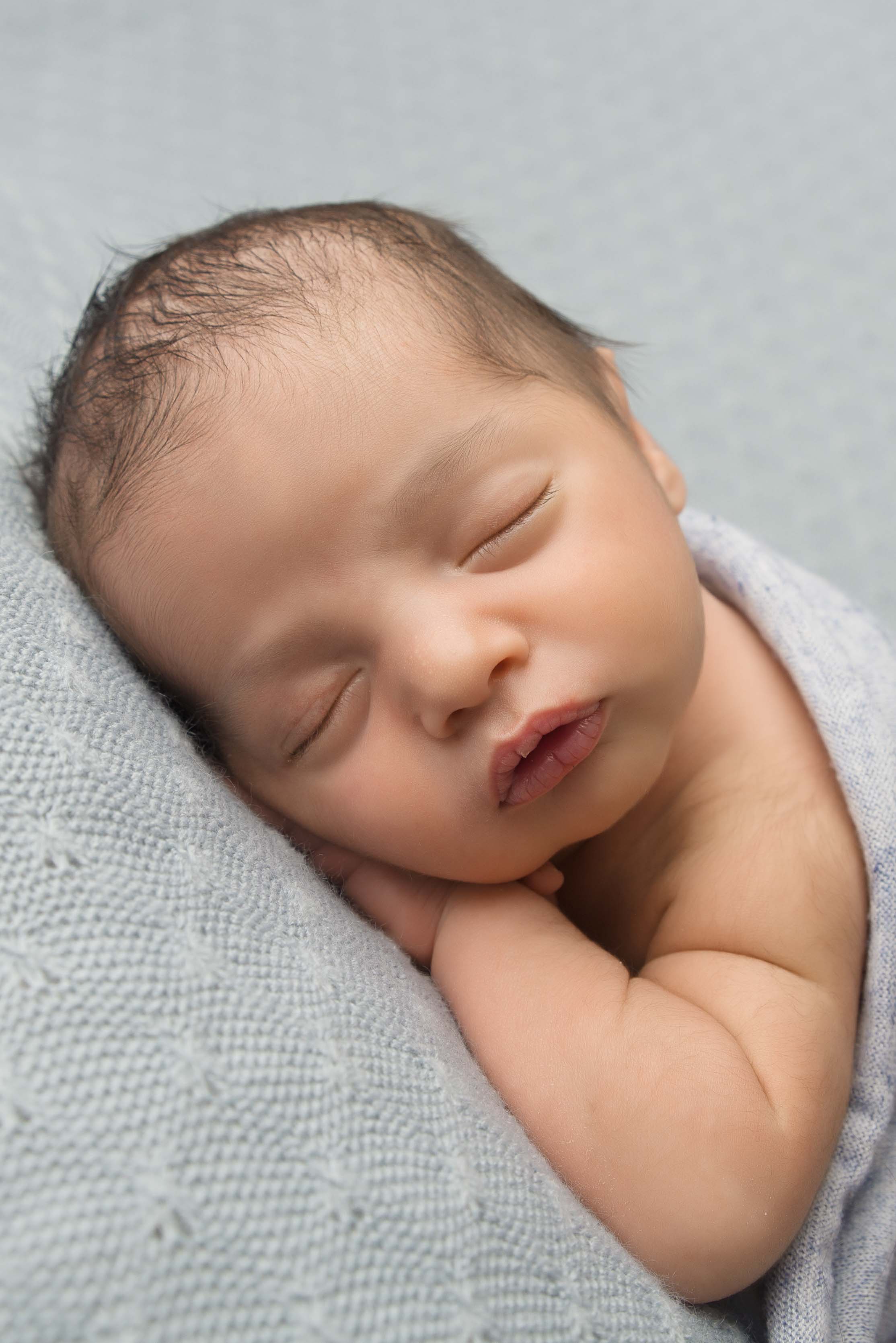 Newborn baby photography close up image.