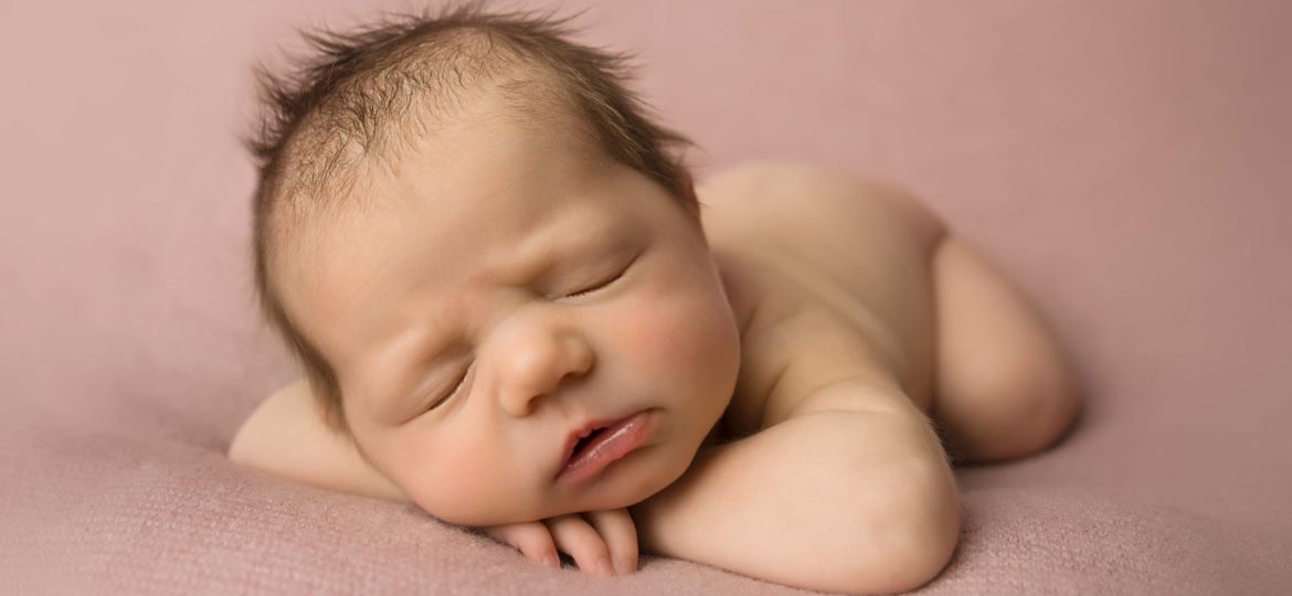 Head on hands pose newborn photography