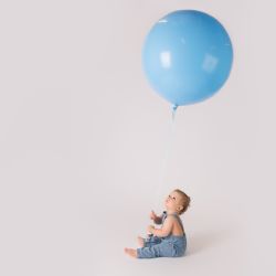 6 month old with huge balloon for photo